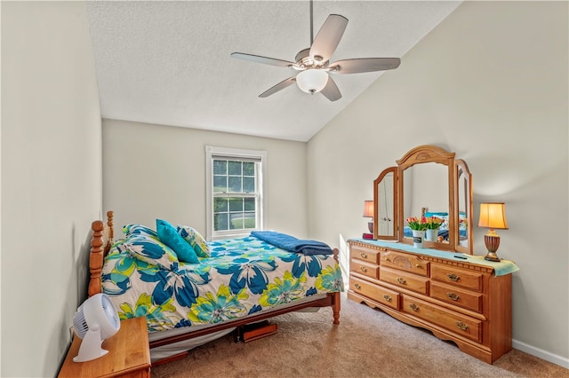 carpeted bedroom with lofted ceiling, ceiling fan, and a textured ceiling