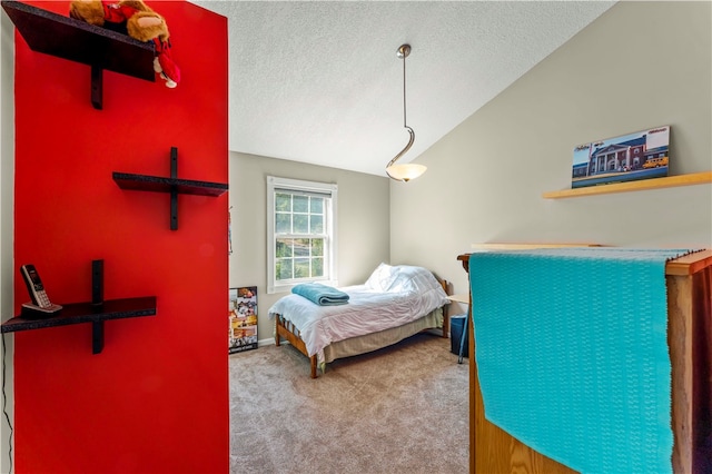 carpeted bedroom featuring a textured ceiling