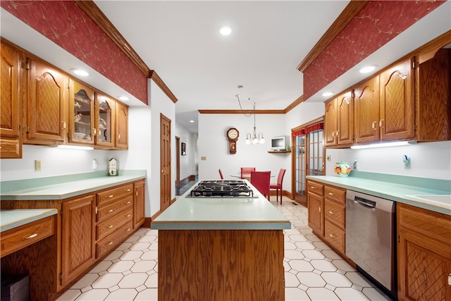 kitchen featuring crown molding, a center island, hanging light fixtures, and appliances with stainless steel finishes