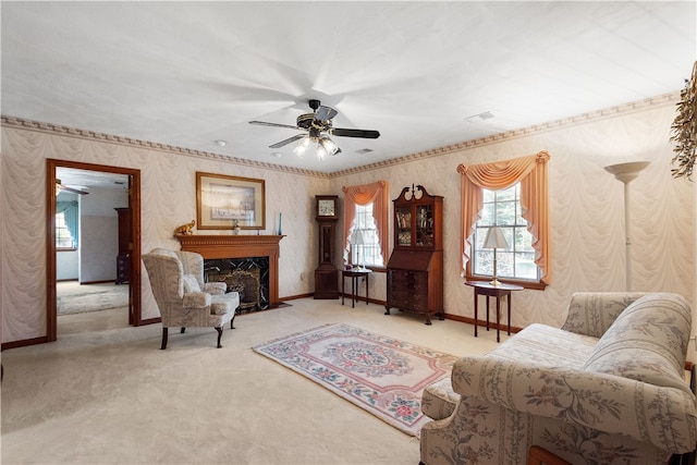 living area featuring light colored carpet, ceiling fan, and a high end fireplace