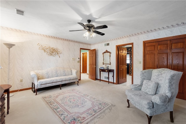 sitting room featuring ceiling fan and light colored carpet