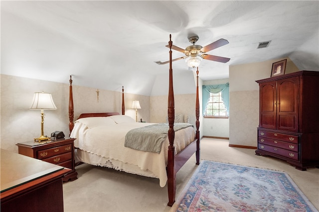 carpeted bedroom featuring vaulted ceiling and ceiling fan