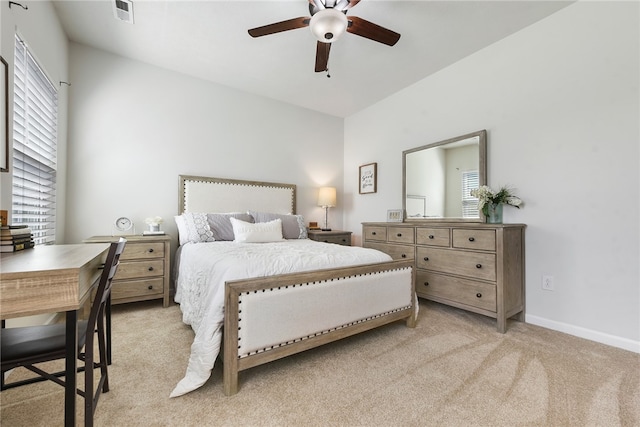 bedroom with light colored carpet and ceiling fan