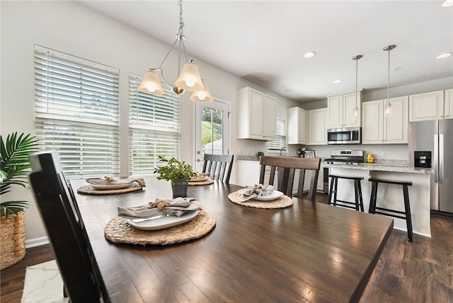 dining space with dark hardwood / wood-style floors