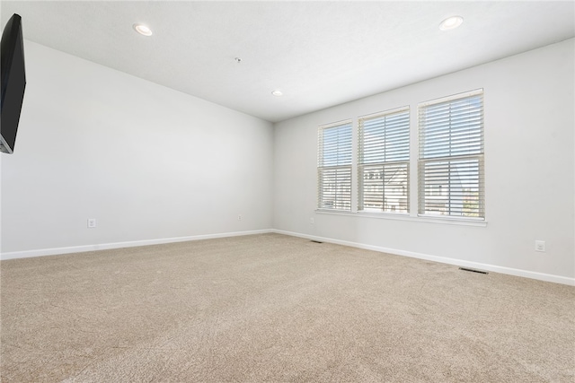 empty room with light colored carpet