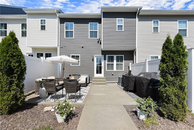 back of house featuring a patio area and outdoor lounge area