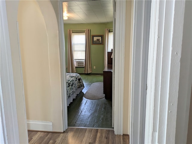 corridor featuring dark hardwood / wood-style floors and cooling unit