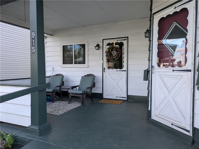 doorway to property with a porch