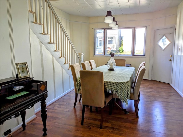 dining area featuring dark hardwood / wood-style flooring