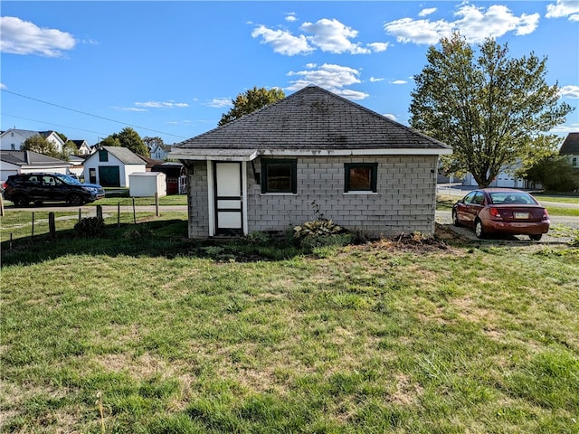 view of home's exterior featuring a yard