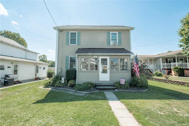 front facade with a front yard