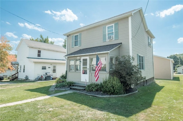 view of front of property with entry steps and a front yard