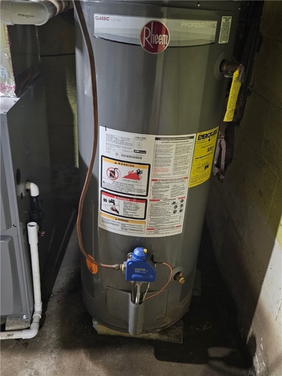 utility room featuring water heater