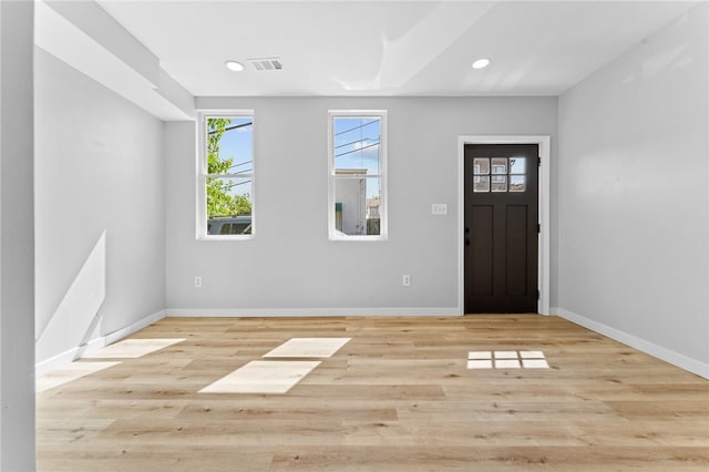 foyer entrance featuring recessed lighting, wood finished floors, visible vents, and baseboards