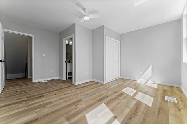 unfurnished bedroom with visible vents, baseboards, and light wood finished floors