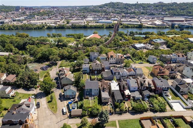 birds eye view of property featuring a water view and a residential view