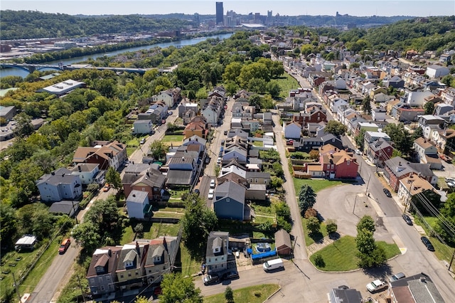 drone / aerial view with a water view and a residential view