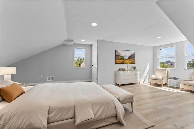 bedroom featuring recessed lighting, visible vents, lofted ceiling, and wood finished floors