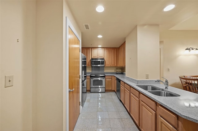 kitchen featuring appliances with stainless steel finishes and sink