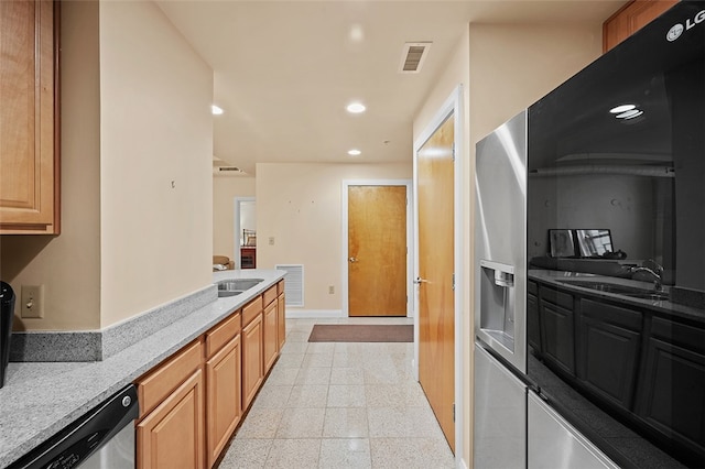 kitchen featuring dishwasher and sink