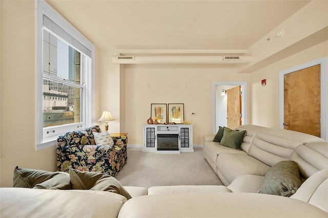 living room featuring light colored carpet