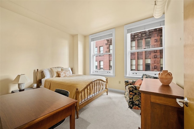 bedroom featuring light colored carpet