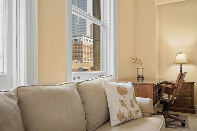 living area featuring a wealth of natural light and carpet