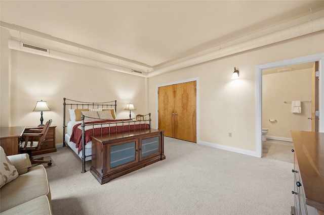 bedroom featuring carpet, a closet, and connected bathroom