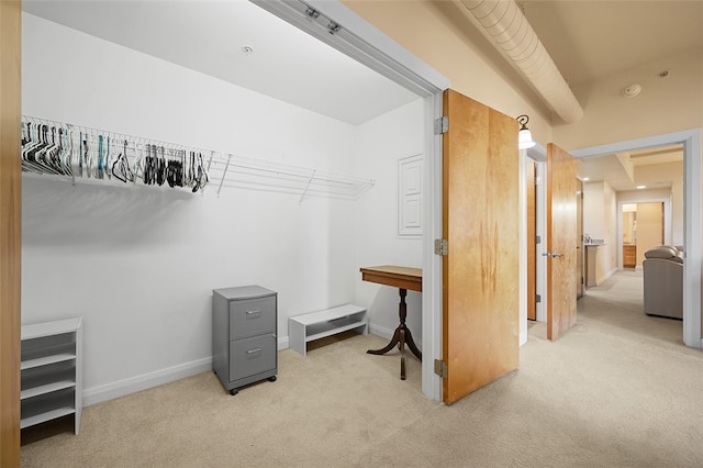 home office featuring light colored carpet