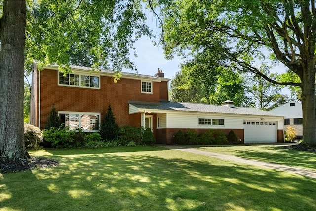 traditional home with a chimney, brick siding, a front yard, and a garage