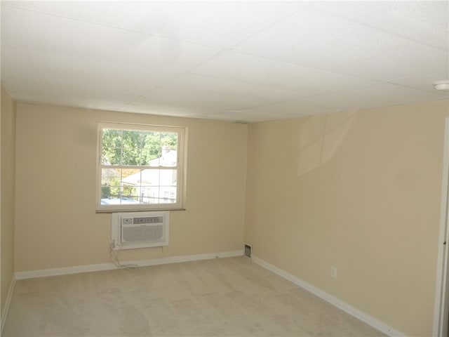 empty room featuring light colored carpet