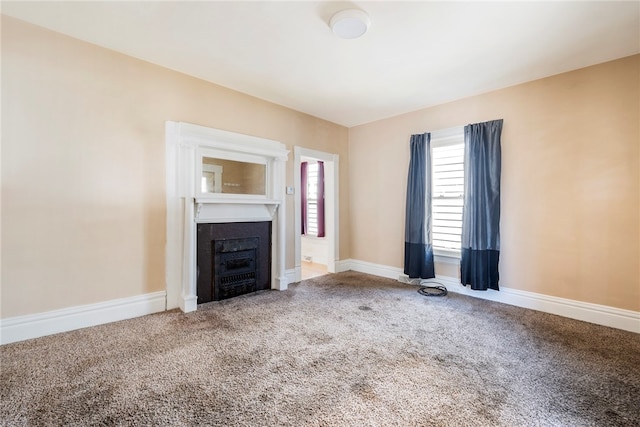 unfurnished living room featuring carpet floors