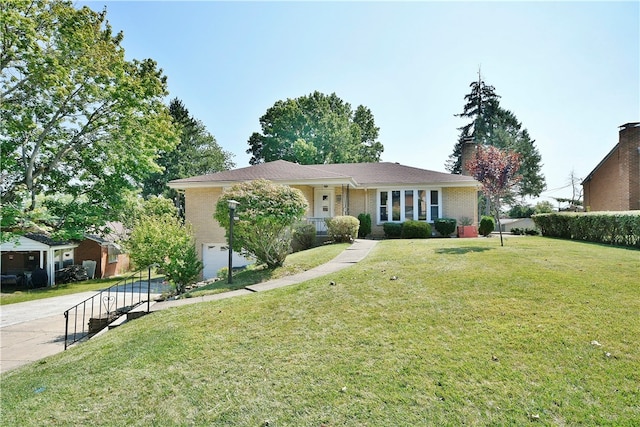 single story home featuring a front yard and a garage