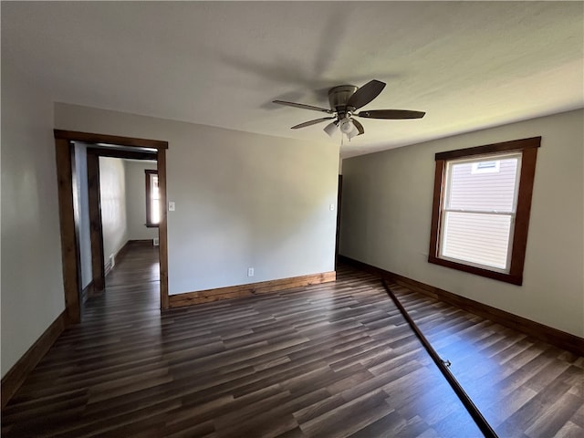 unfurnished room with ceiling fan and dark hardwood / wood-style floors