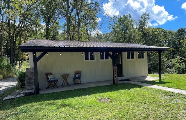 exterior space with a patio area and a front yard