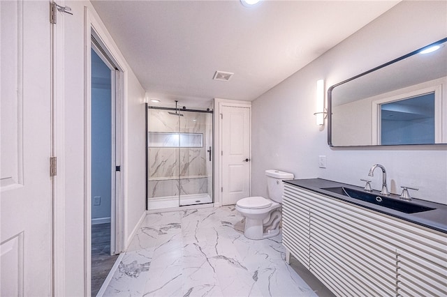 bathroom with vanity, toilet, and a tile shower