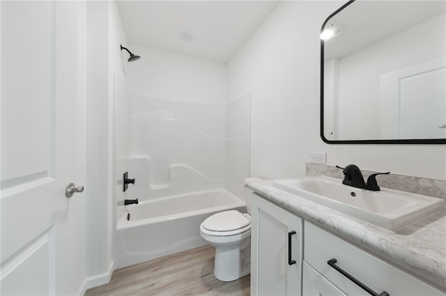 full bathroom featuring shower / bathing tub combination, vanity, toilet, and hardwood / wood-style floors