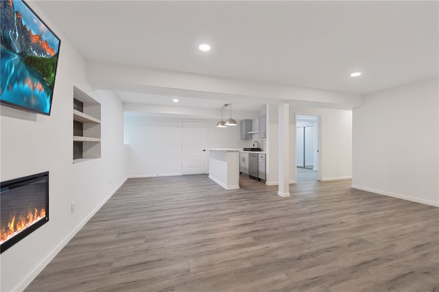 unfurnished living room with hardwood / wood-style floors