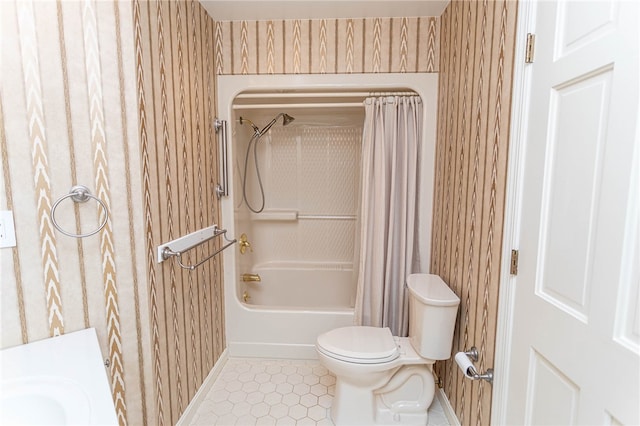 full bathroom featuring toilet, sink, and shower / bath combination with curtain