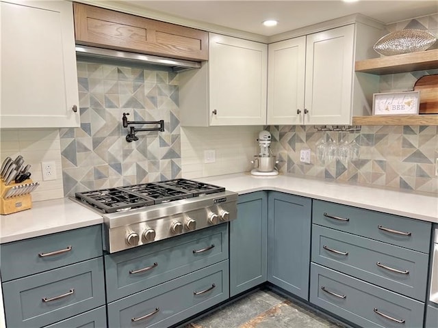 kitchen featuring white cabinetry, tasteful backsplash, and stainless steel gas stovetop