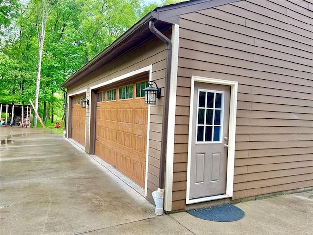 garage featuring wooden walls