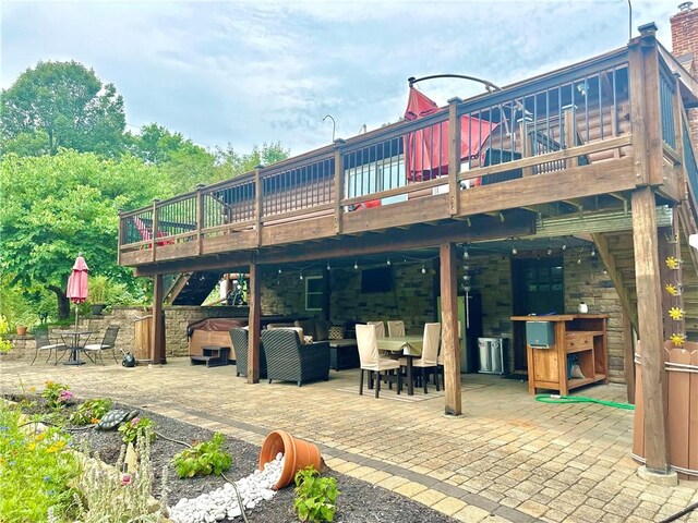 rear view of property featuring a patio, outdoor lounge area, and a deck