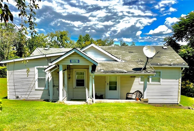 bungalow-style house with a front lawn