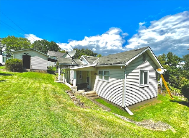 rear view of property with a yard