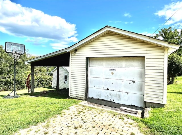 garage featuring a yard