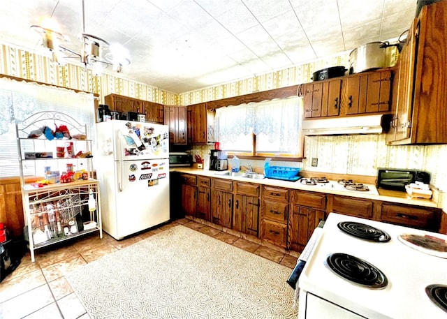 kitchen featuring sink and white appliances