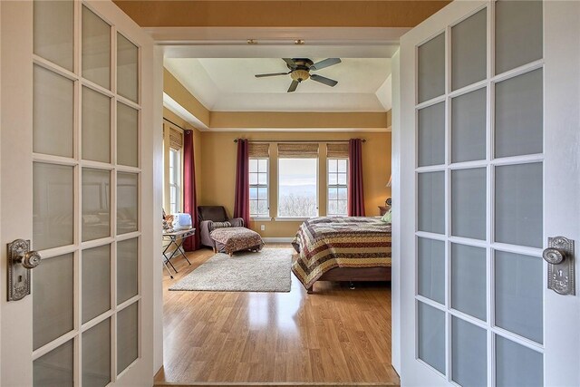 bedroom featuring light hardwood / wood-style flooring and ceiling fan