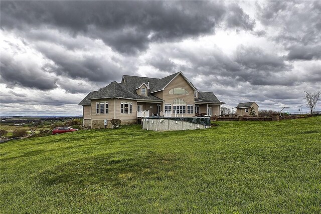 back of property featuring a lawn