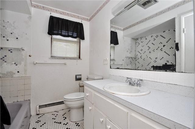 full bathroom with toilet, tile patterned floors, vanity, a baseboard radiator, and shower with separate bathtub