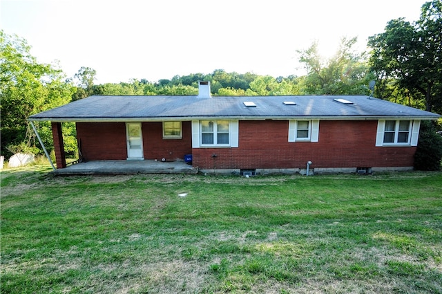 ranch-style house with a front lawn